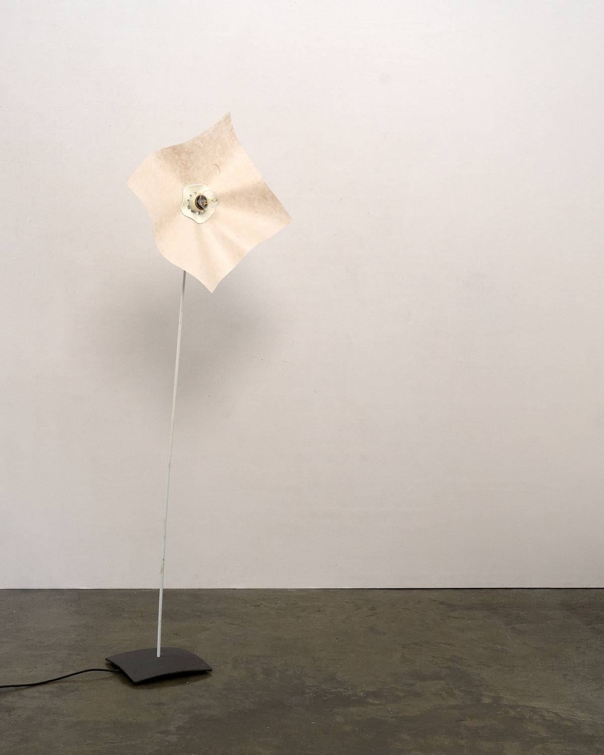 Area 160 floor lamp profile view with illuminated origami shade