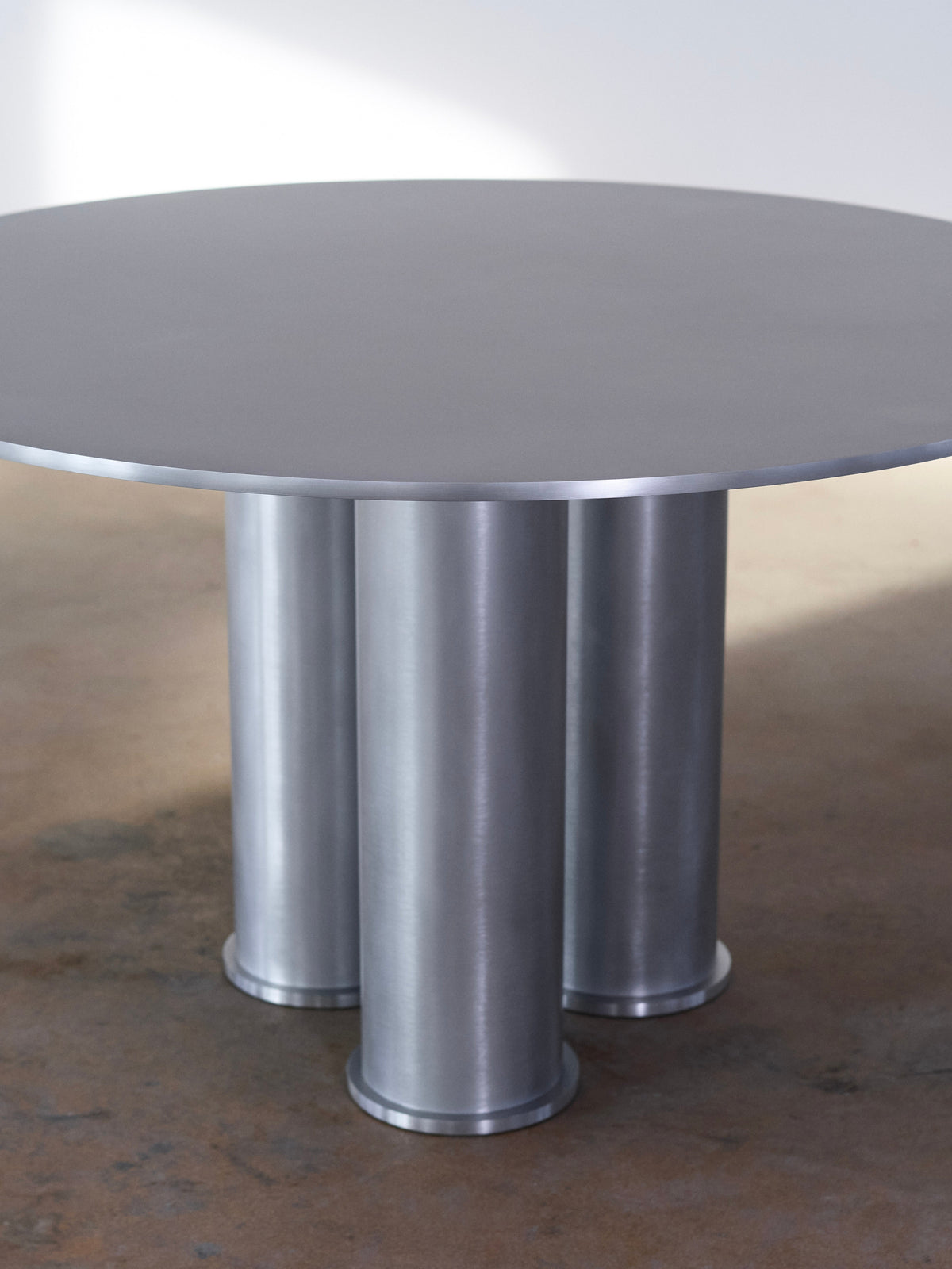 Elephant Table (Dining) — top view of round metal surface