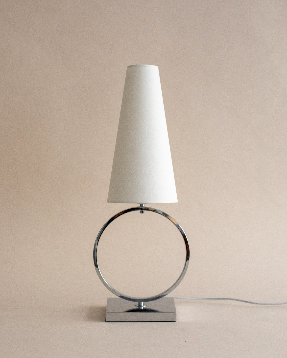 Modern Olhao table lamp with circular chrome base and white shade