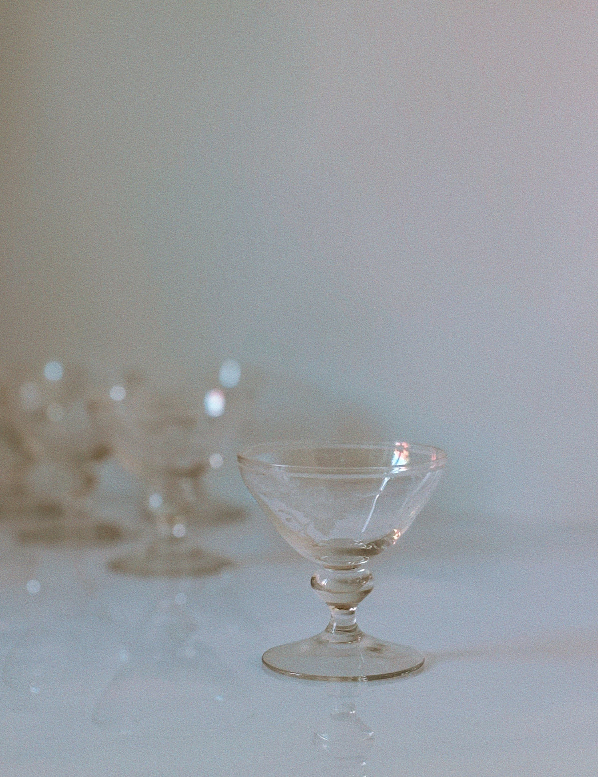 Clear etched floral dessert wine glass with ornate stem design