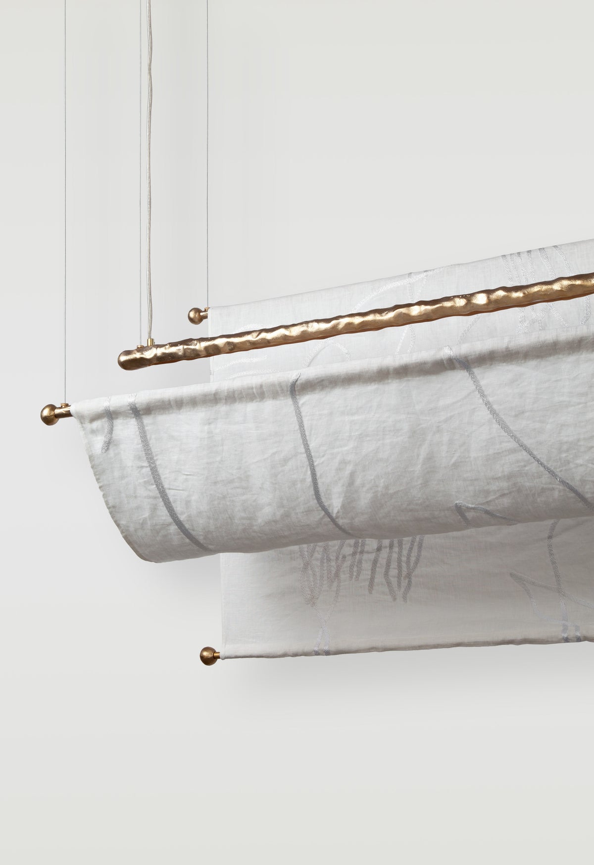 Aria Ceiling — close-up of fabric shade with brass accents