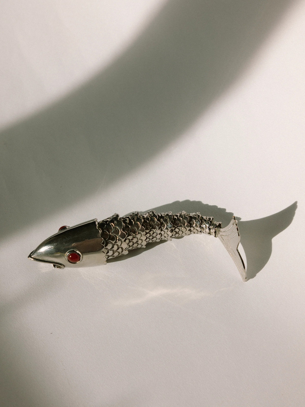Vintage French Articulated Silver-Plated Fish Bottle Opener c. 1970s — lifestyle setting