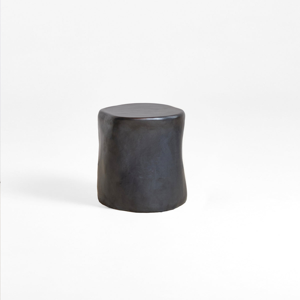 Ceramic Side Table (small) — front view of matte black surface