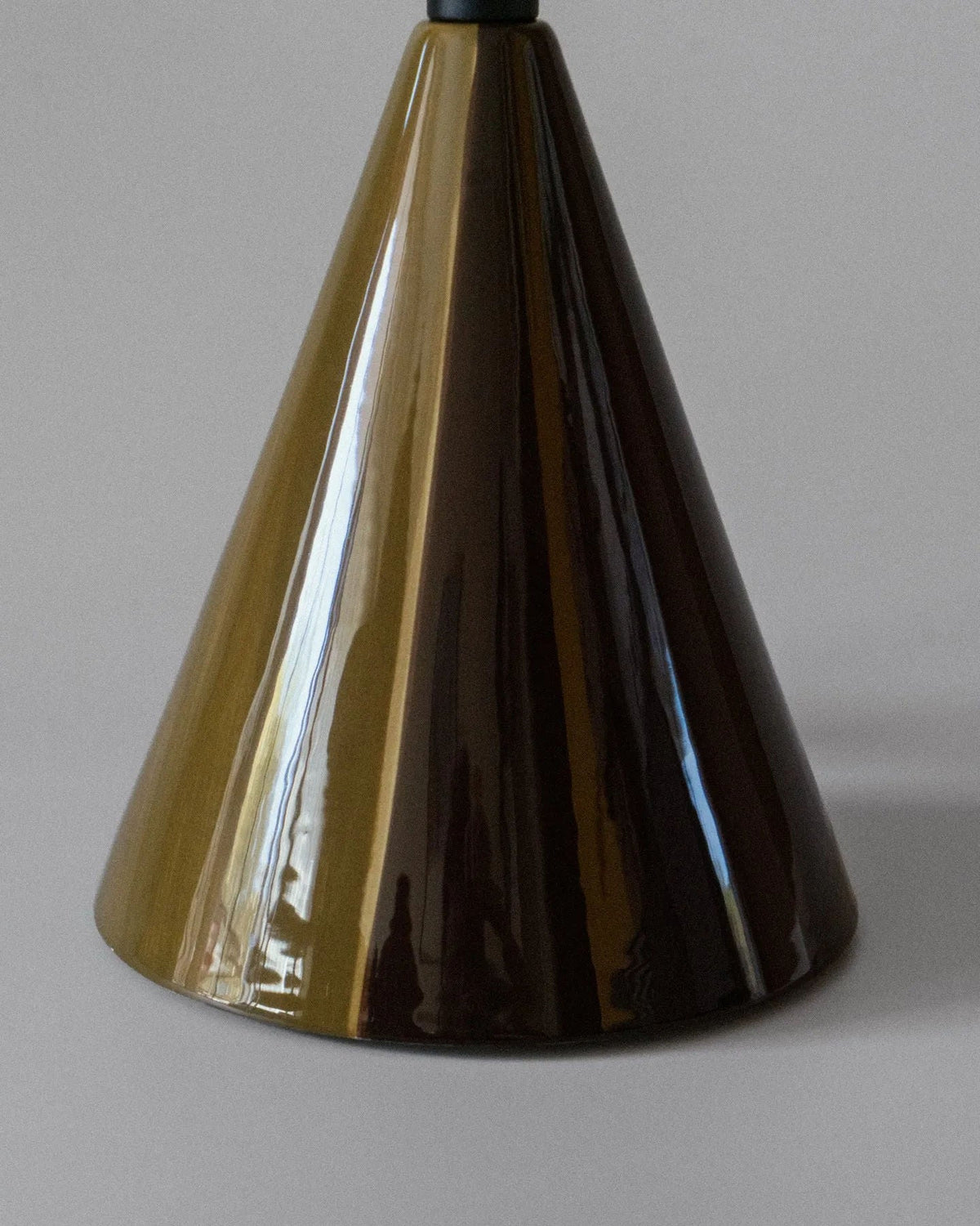 Caterina Table Lamp - Dark Brown — close-up of glossy conical base