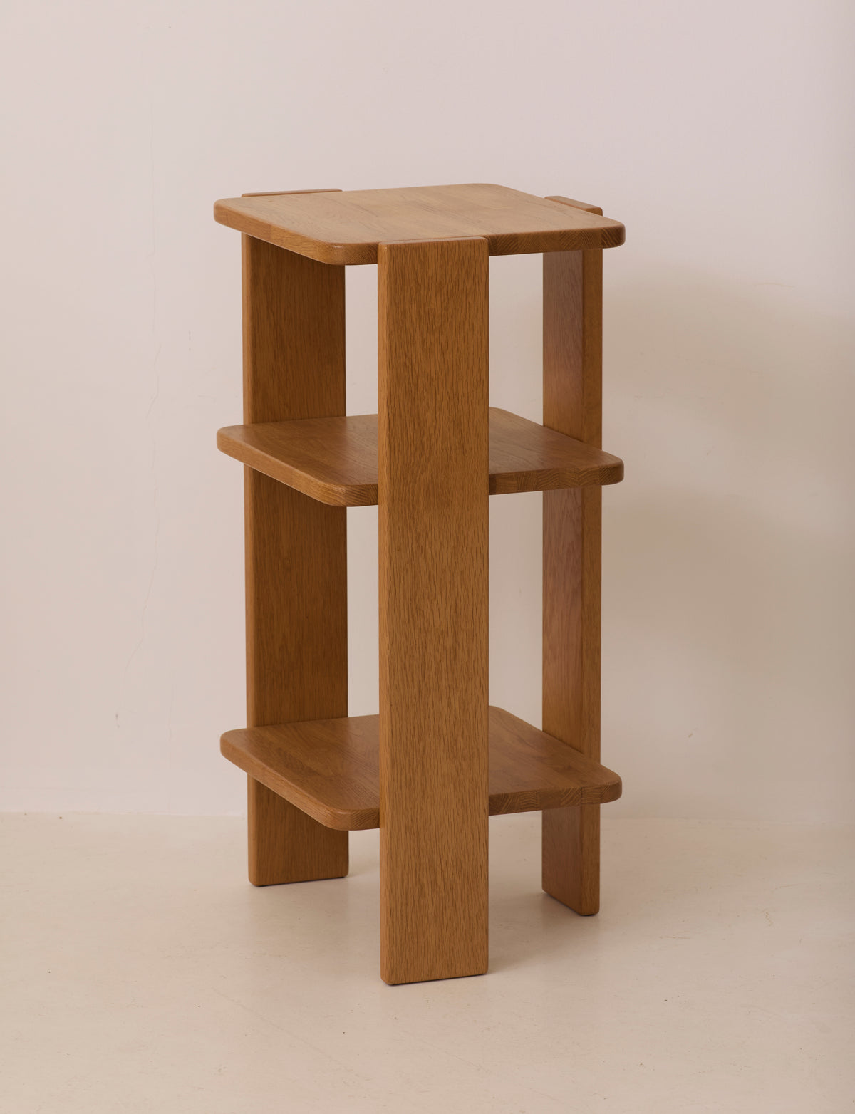 French Artisanal Shelf in Solid Oak c. 1980 — angled view against plain wall