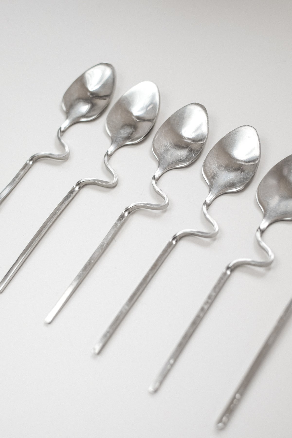 Zigzag Cutlery Set — arranged on light background showing silver finish