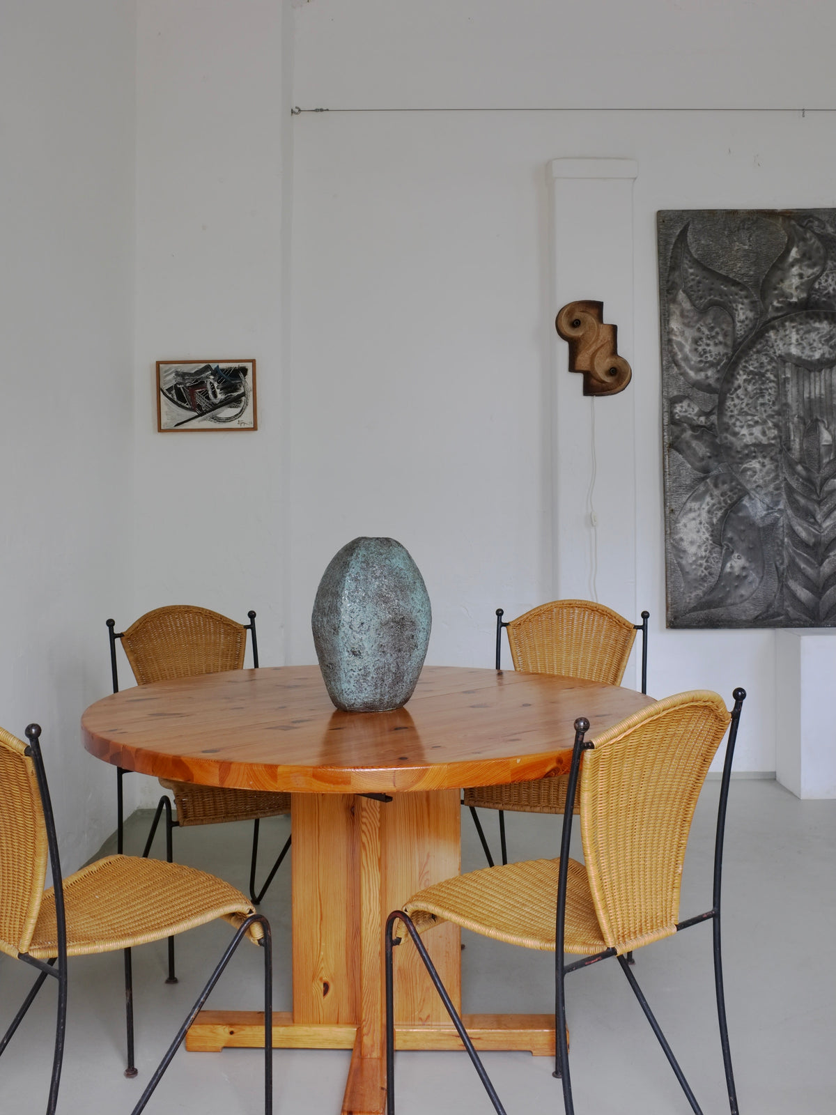 Frederick Weinberg wicker chairs around wooden dining table lifestyle