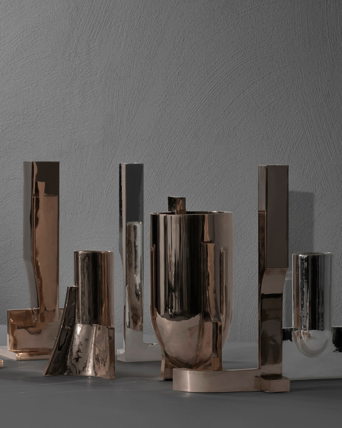 Case obj.8 - Candleholder Wall Piece — side angle of polished metal design