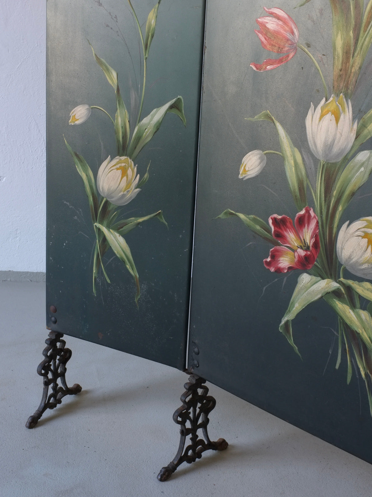 Art Nouveau painted screen detail showing tulip motifs on ornate stands