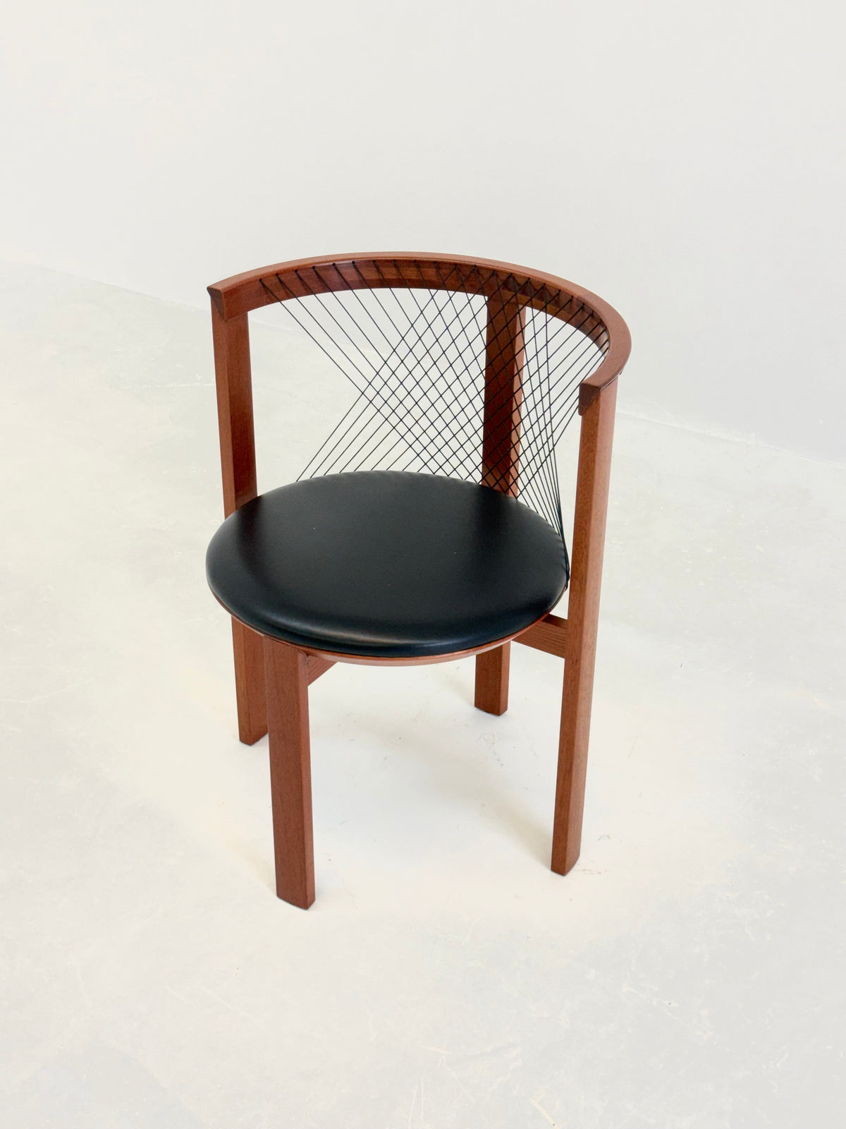 Set of Tranekær String chairs by Niels Jørgen Haugesen — side angle