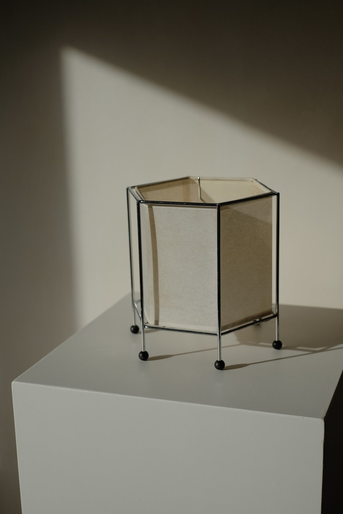 Japanese Rice Paper Table Lamp — side view on white pedestal