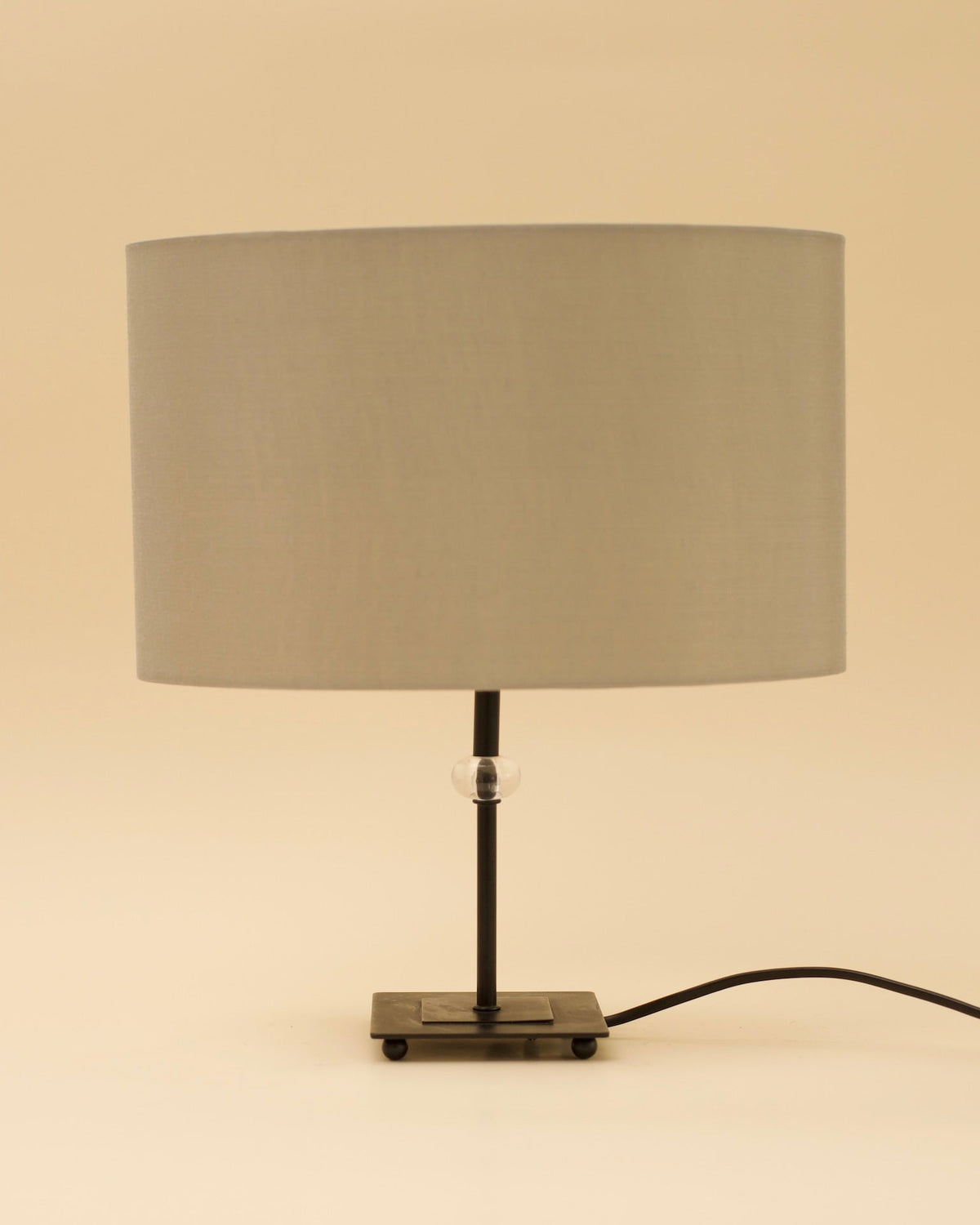GUNTA Table Lamp — close-up of gray fabric shade and metal base