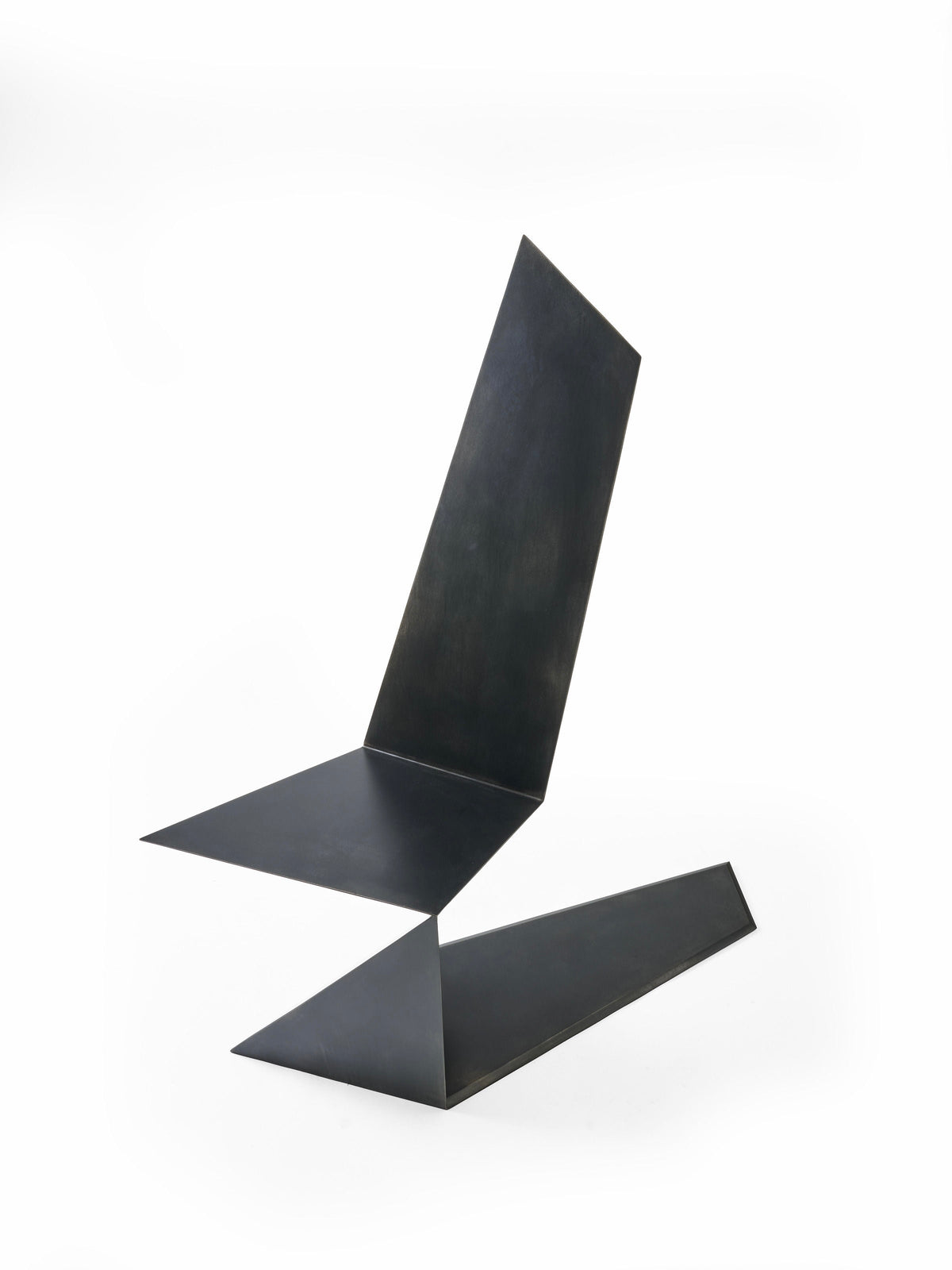 DARK SIDE chair in metal, aluminum and black patina — angled view highlighting geometric design