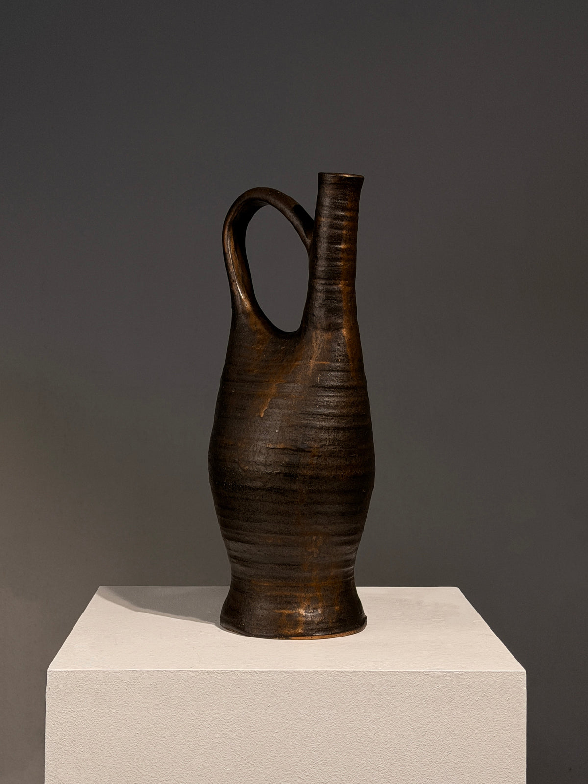 Large Stoneware Pitcher by Bernadette Sulmont, France, circa 1960 — side angle showing textured dark surface on pedestal
