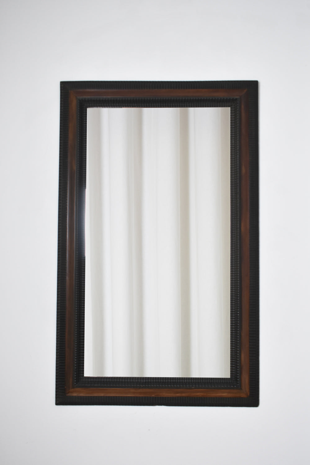 Carved ebonised wood mirror and trompe l'oeil turshell, XIXth c. — detail view