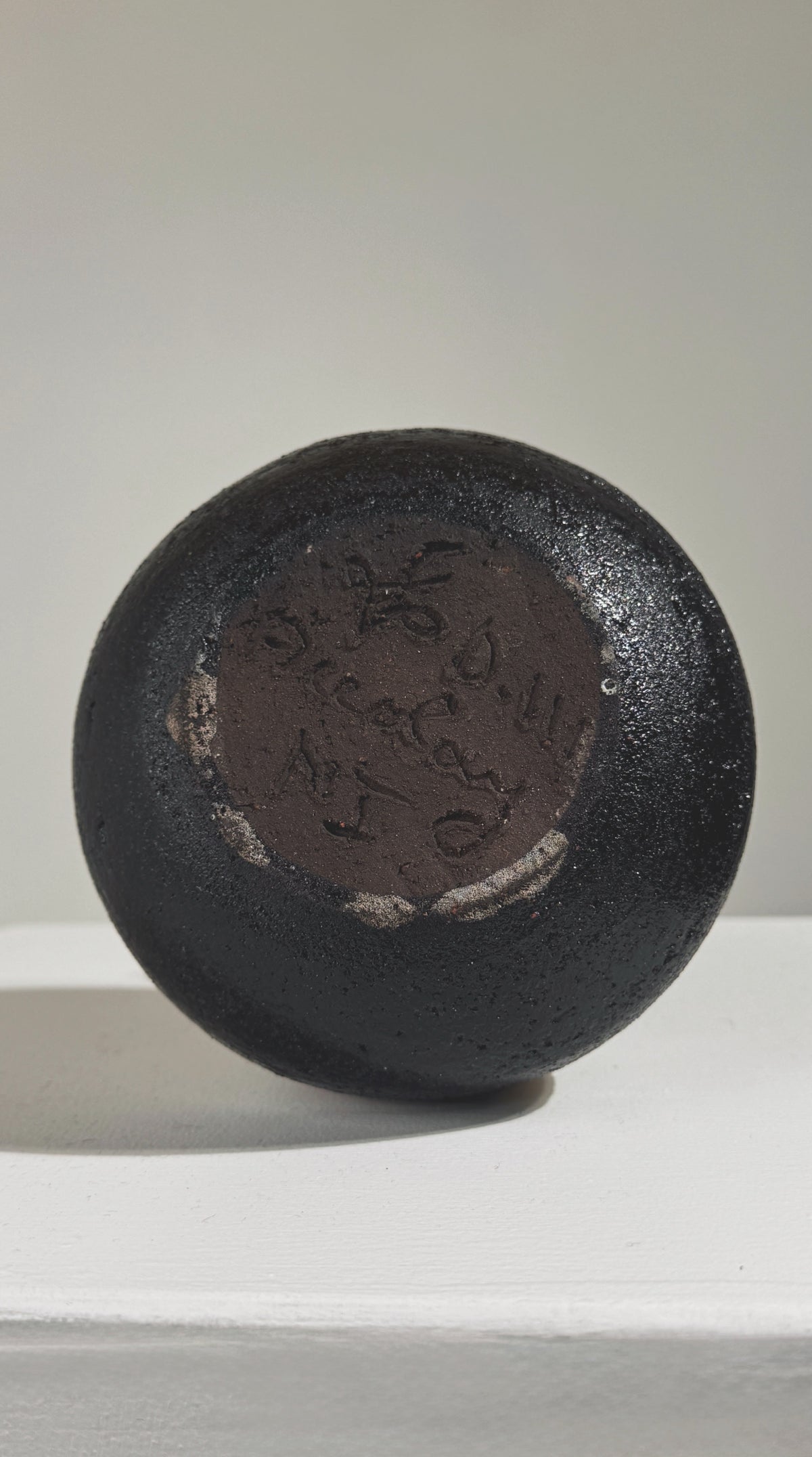 Bottom view showing maker's mark on vintage Accolay stoneware pitcher