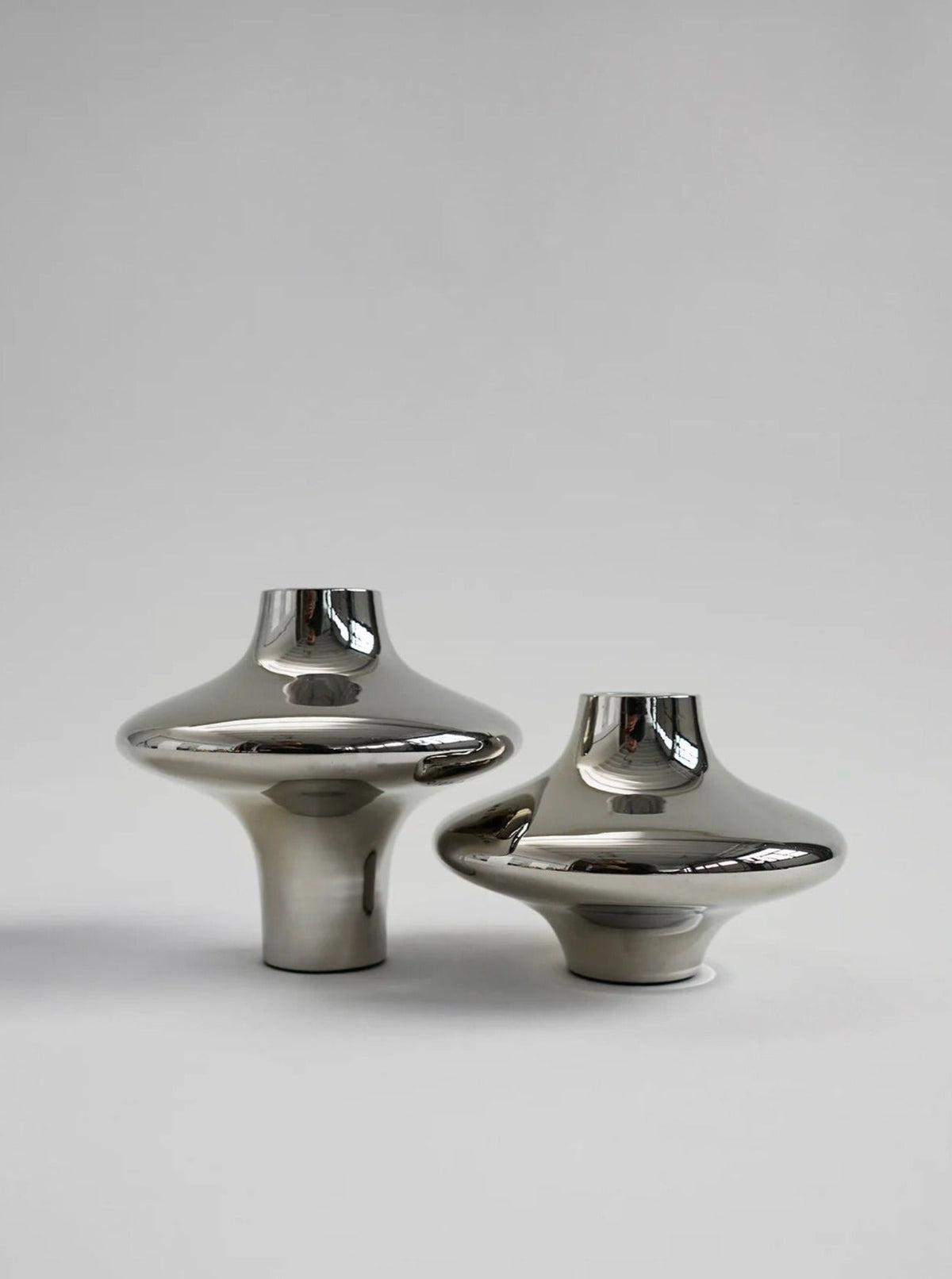 Doublet Candleholder - Large - Silver — close-up of polished silver surface