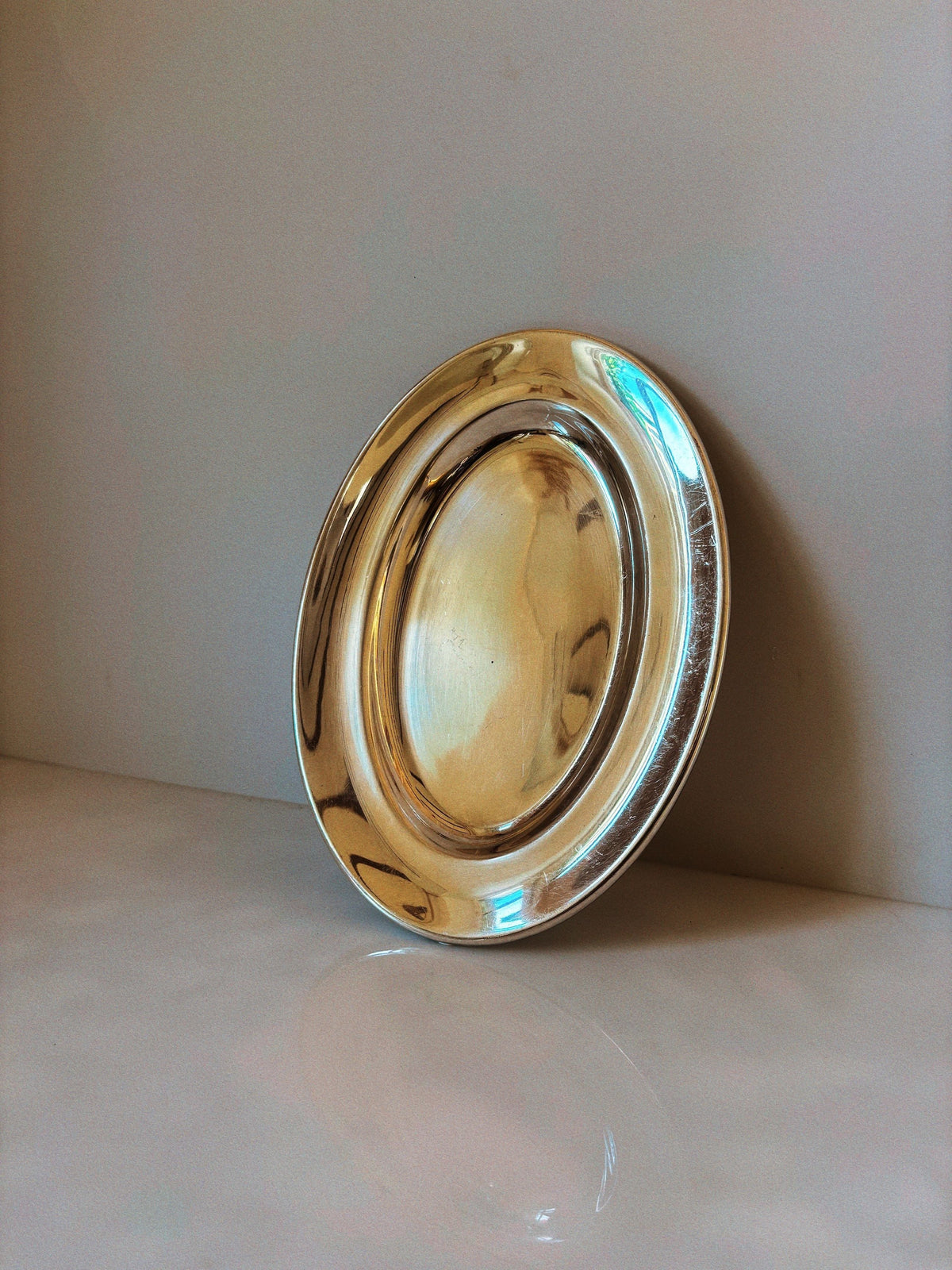 Silver plated oval serving platter with polished reflective finish
