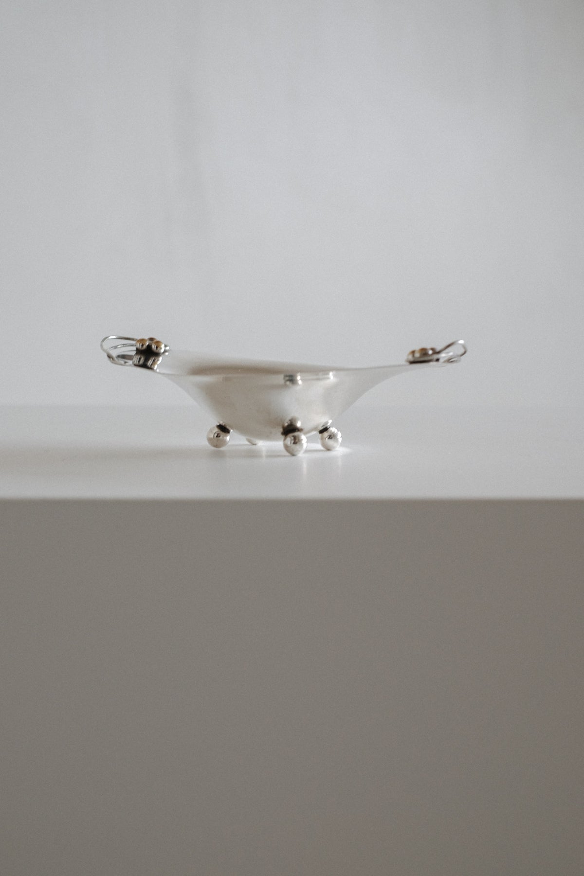 Small Silverplated Bowl — side angle on white surface