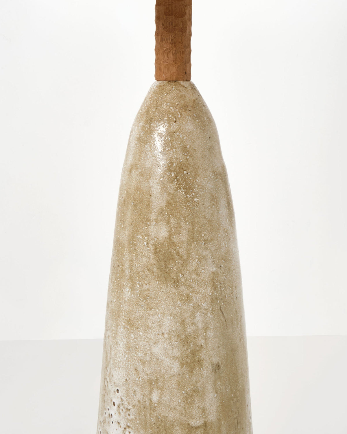 Quinta Floor Light No2 — side angle showing textured ceramic base