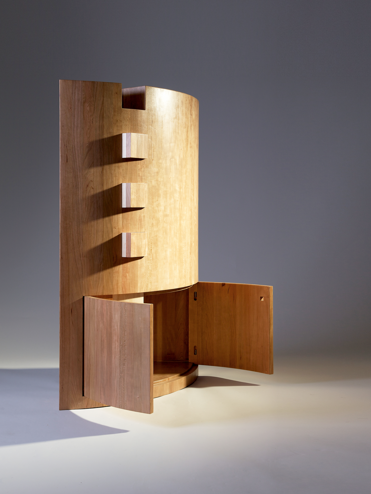 ARound Memory Cabinet — side angle showing natural wood finish and open doors