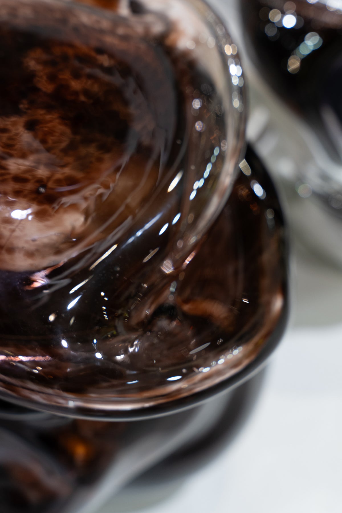 Wave Stool / Side Table I — close-up of glossy brown resin surface