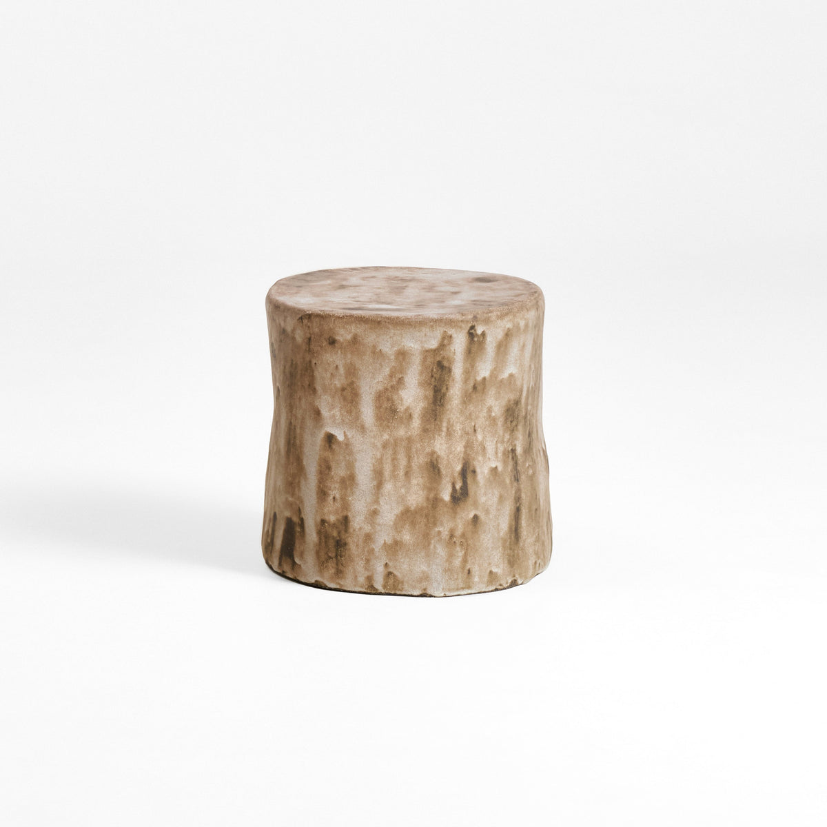 Ceramic Side Table (small) — side angle showing textured beige surface