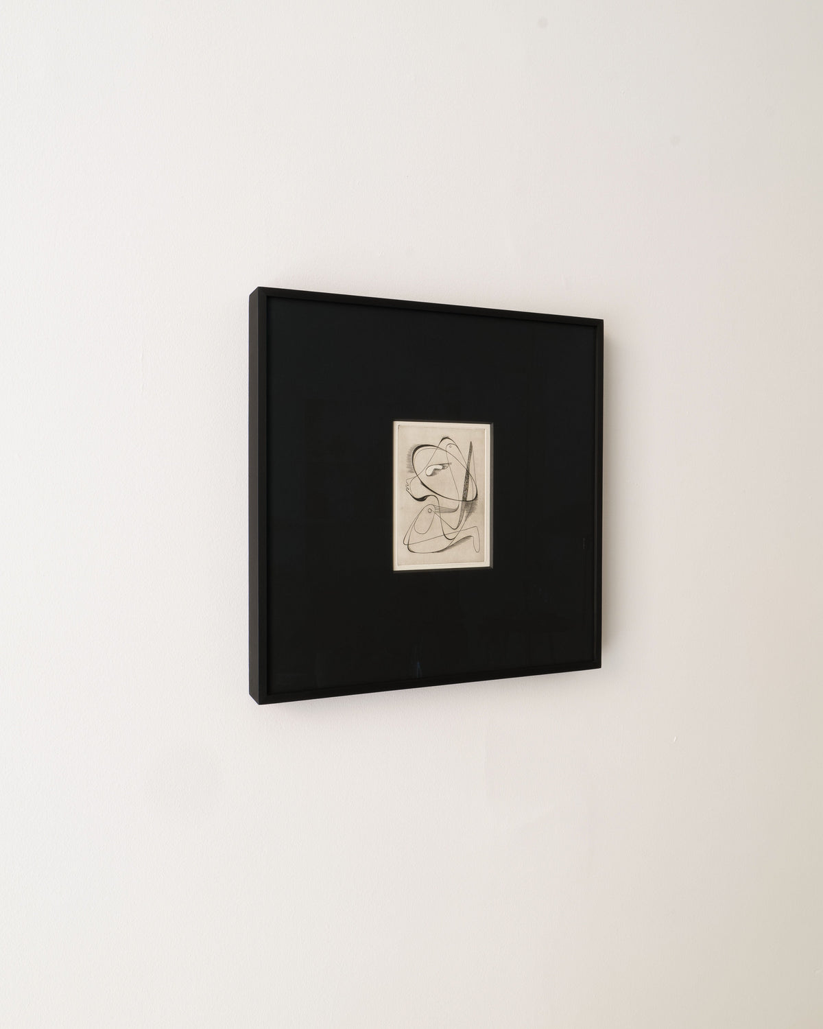 Surrealist Engraving Painting Sylvain Durand — side view in black frame on wall
