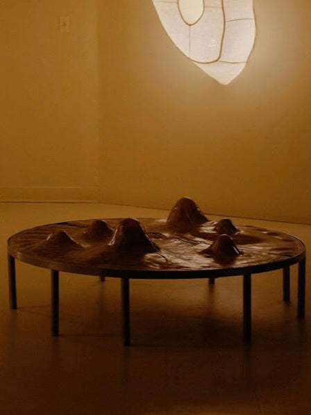 Phantom: Rawhide' Table — side angle showing textured rawhide surface