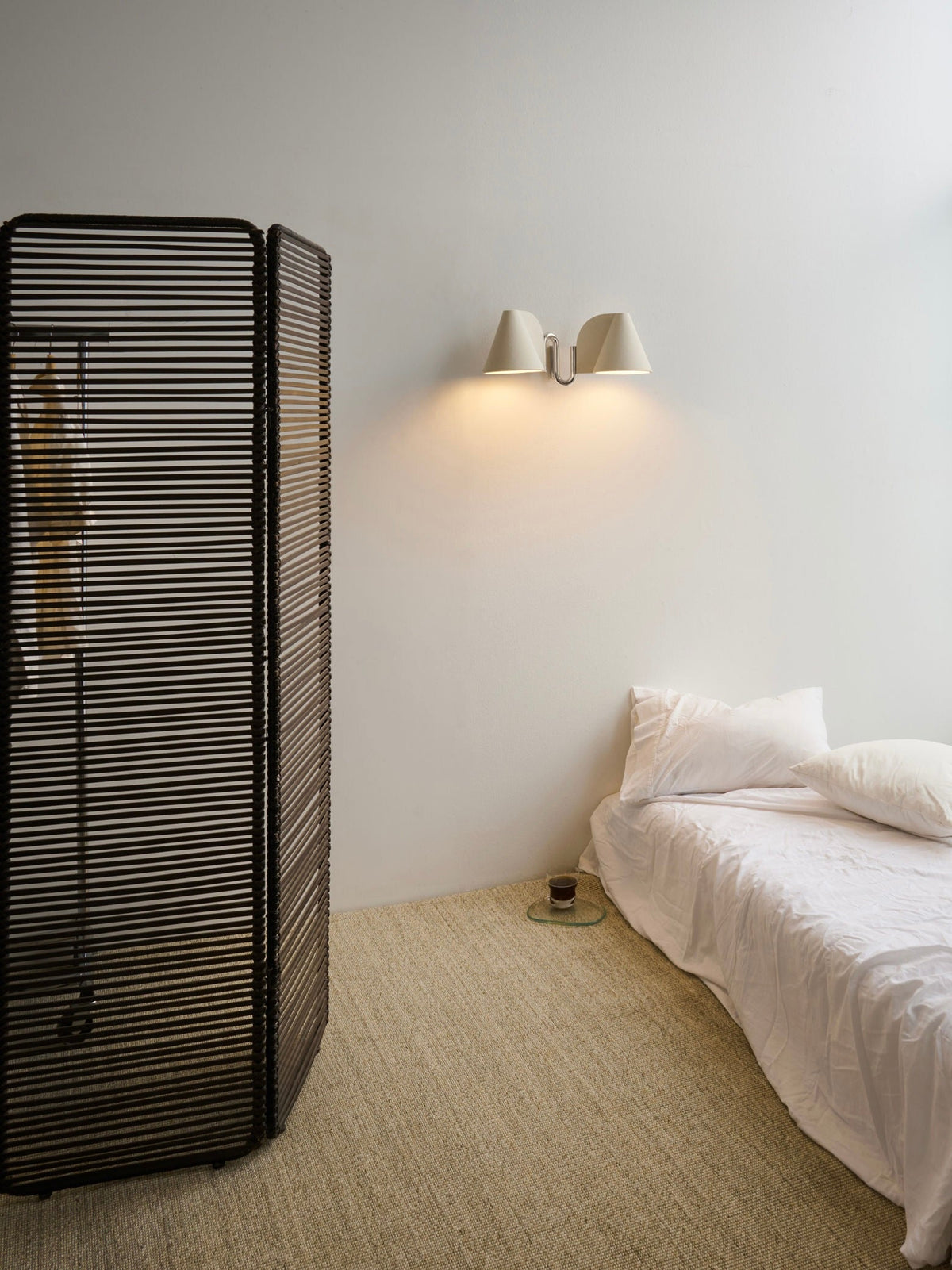 Synapse Wall Light — mounted on wall beside bed in modern setting