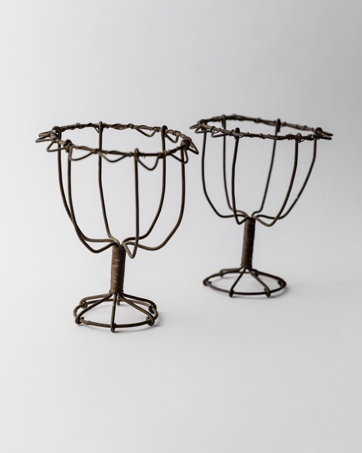 Antique 1850s Iron Wire Candleholder Set of 2 — side angle showing dark iron wire design