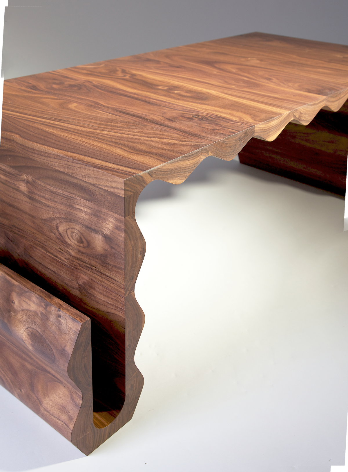 Optable Coffee Table — angled view of walnut wood surface