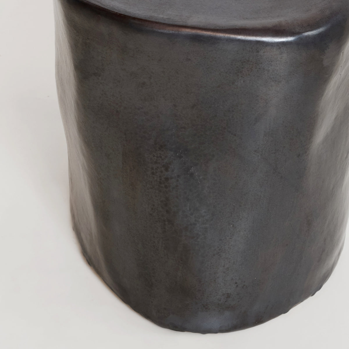 Ceramic Side Table (small) — close-up of textured dark ceramic surface
