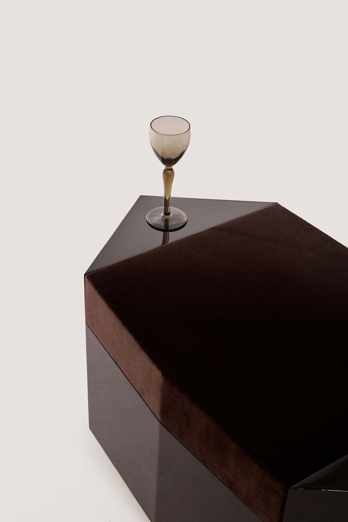 Ame I' Lacquer Ottoman — top view with dark velvet cushion and glass