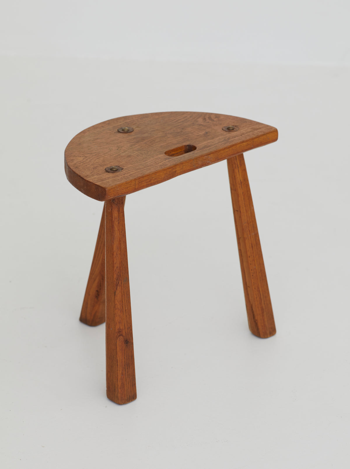 Two French Artisanal Solid Wood Half-moon Tripod Stools, Circa 1950 — side angle showing wooden seat and legs