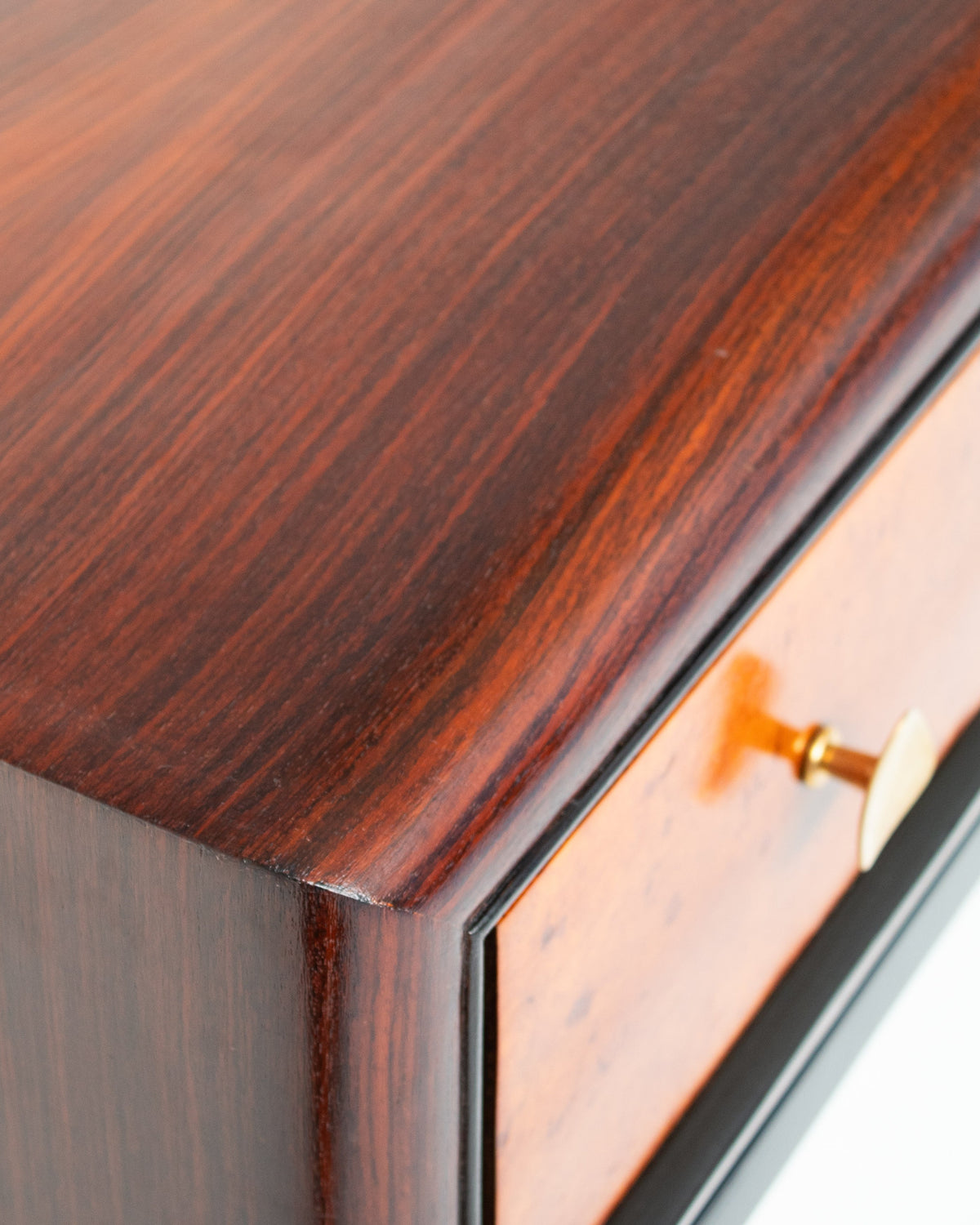 Close-up of rosewood Art Deco console with brass handle detail