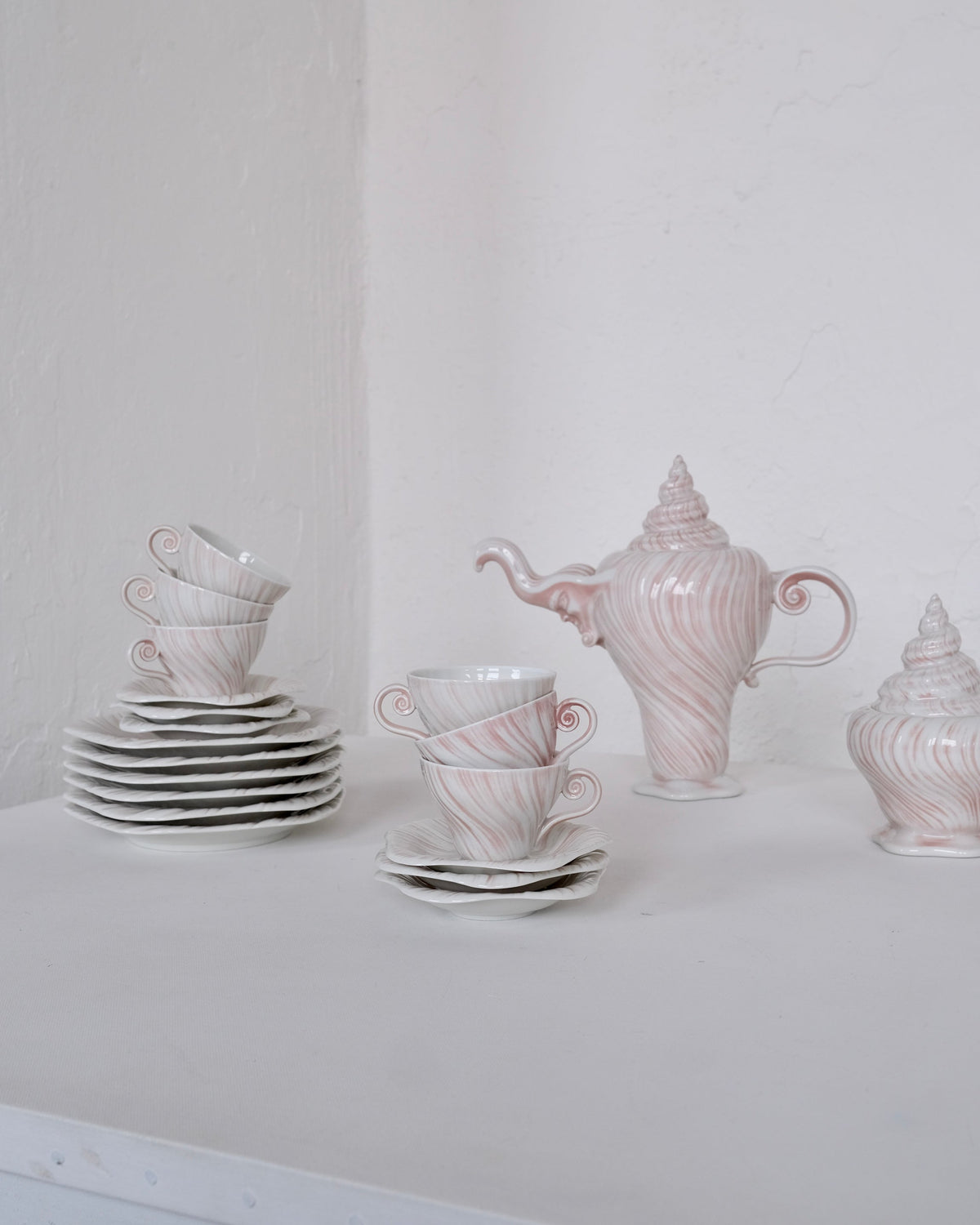 Porcelain Coffee Set "Rose Triton" by Arje Griegst for Royal Copenhagen, 1970s — close-up of stacked cups with pink swirls