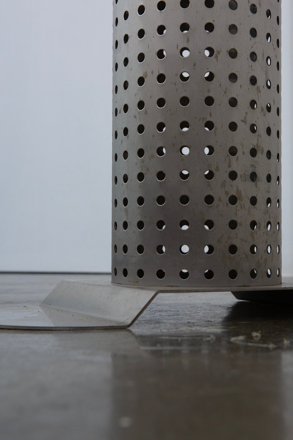 Postmodern Stainless Steel Dining Table, c.1980 — close-up of perforated metal base