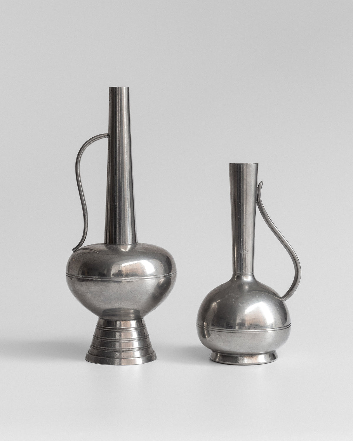 Pair of Pewter Vessels by GAB, Sweden, 1950s — side angle showing polished metal finish