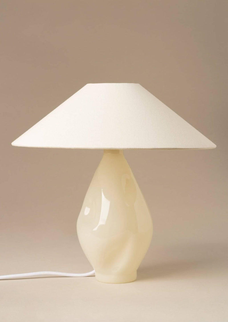 Beige glazed ceramic table lamp with conical linen shade