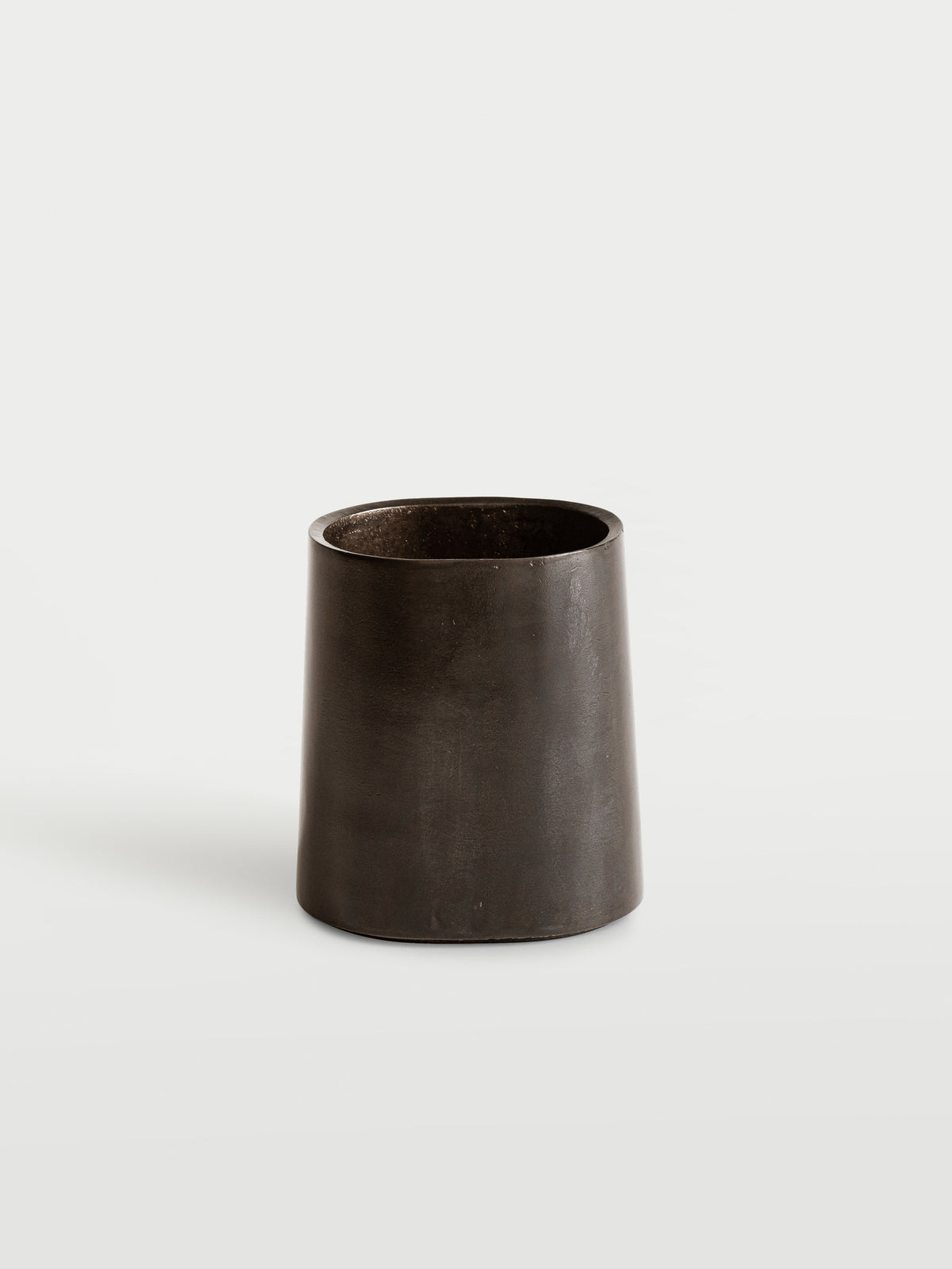 Taper Pen Stand — angled view of matte black metal design