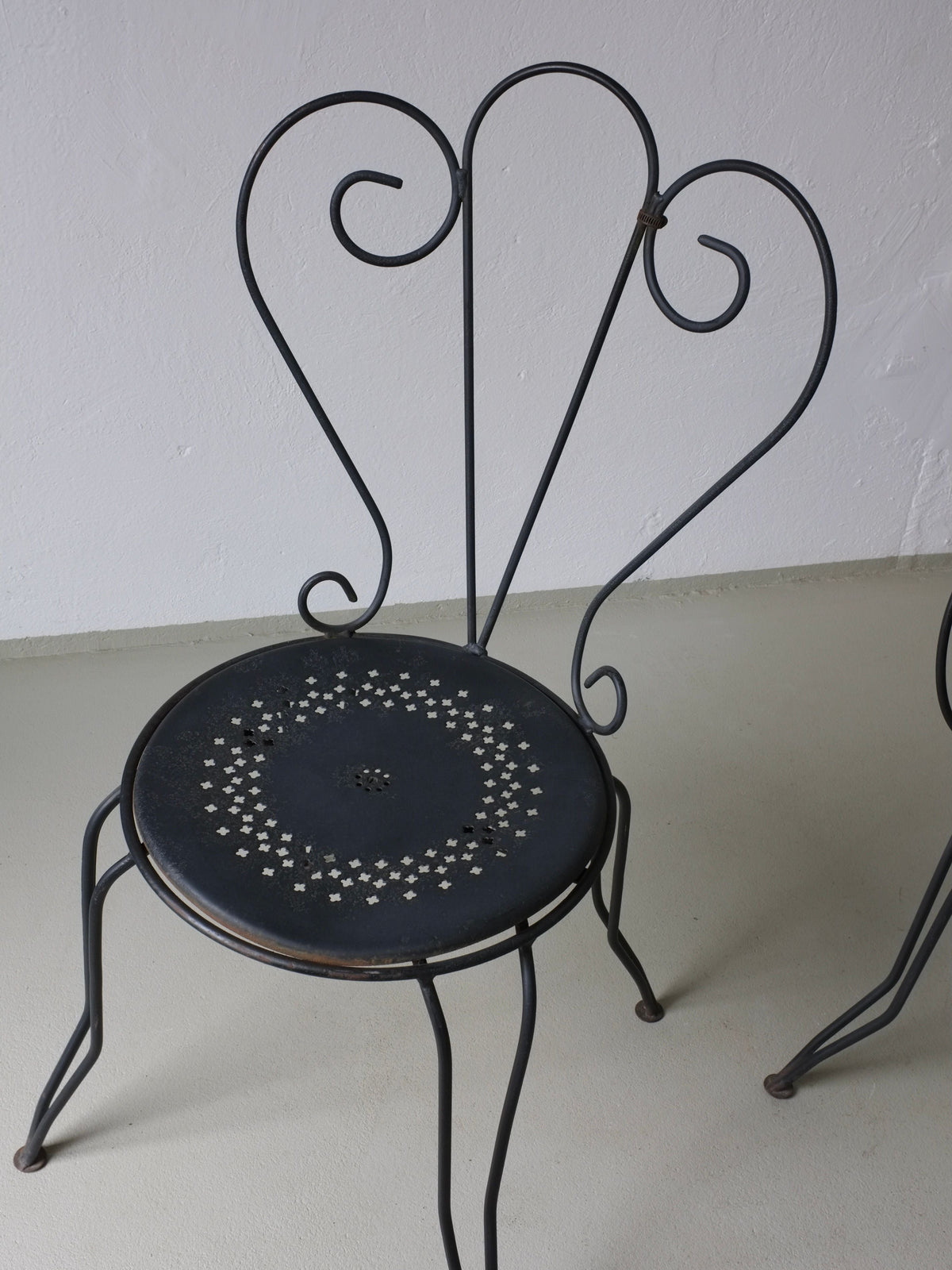 Wrought Iron Garden Dining Set, 1950s France — back view of black chair with decorative seat