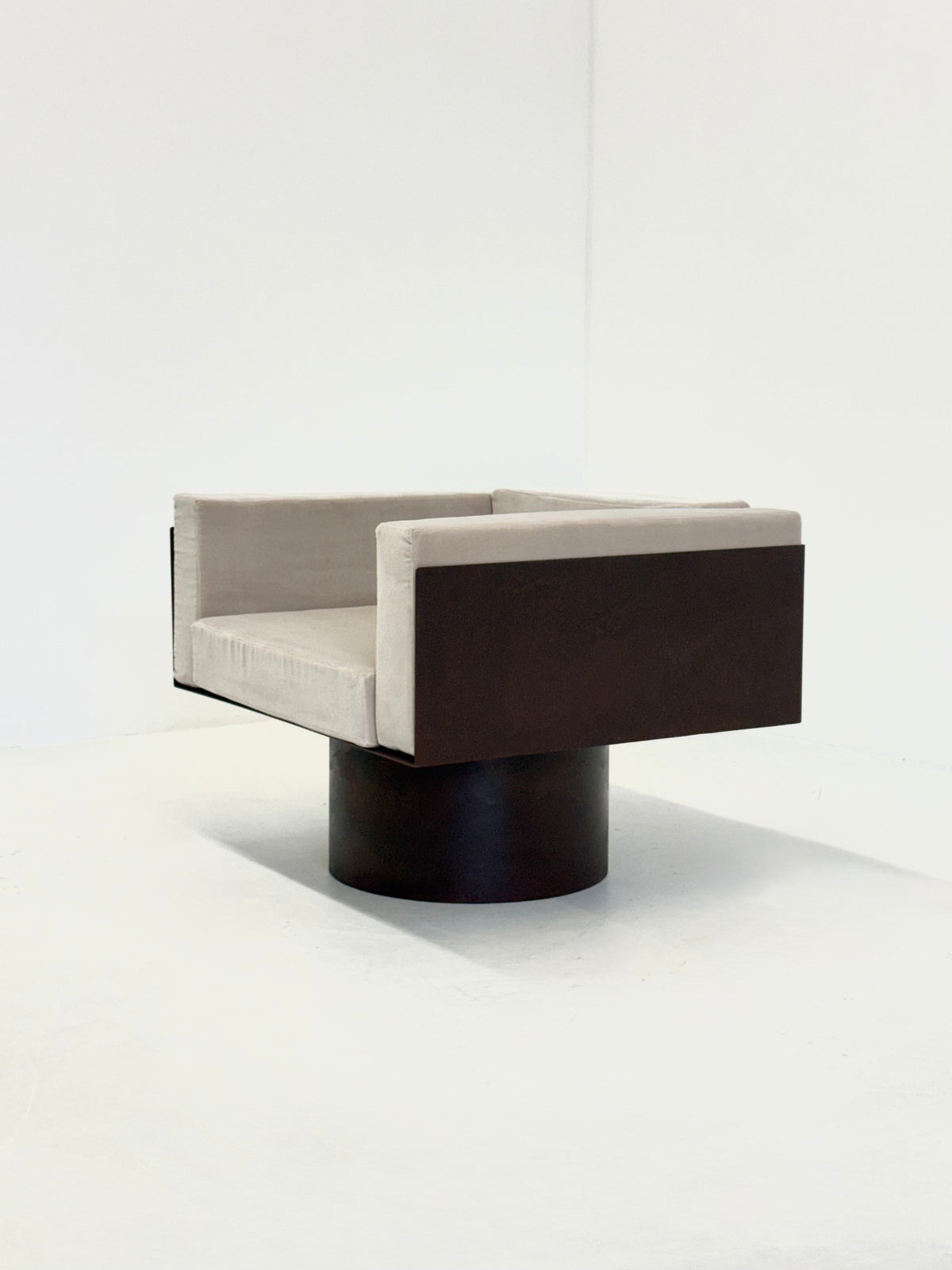 Sculptural Italian metal lounge chair — lifestyle setting