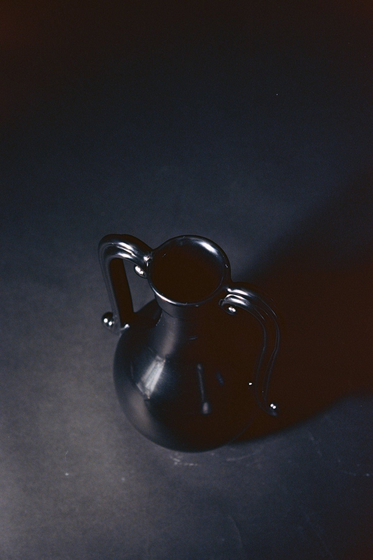 The Fiasca - Minimalist Vase in Ceramic — top view on dark background