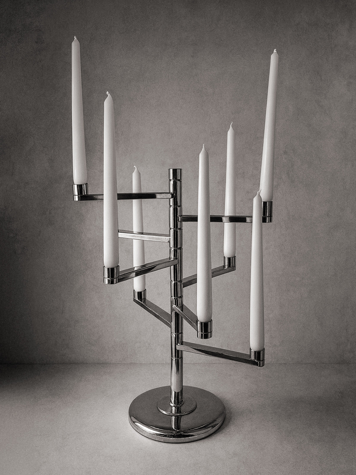 Silver-plated Candelabra by Lambert 80s — close-up of polished metal base with candles