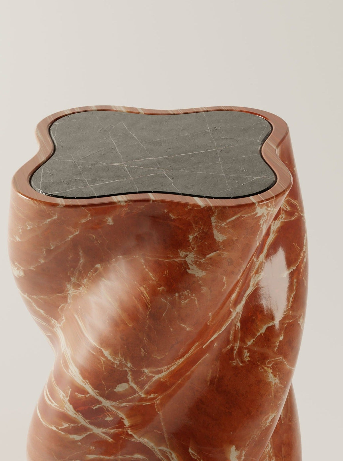 The fUUUUsillo Rosso Alicante by BURGIO. features a sculptural, glossy reddish-brown twisting base and an irregular nero marquina marble top, shown against a plain light background.