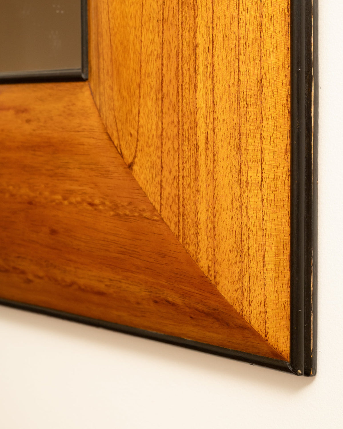Corner detail of 1950s Italian wooden mirror frame showing grain