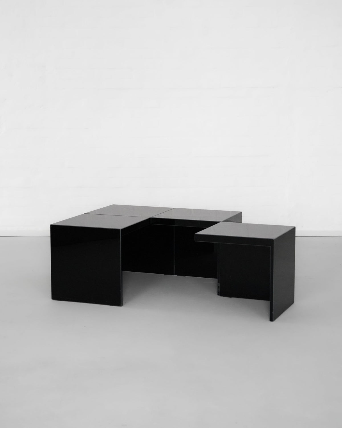 Black geometric modular side tables with interlocking design