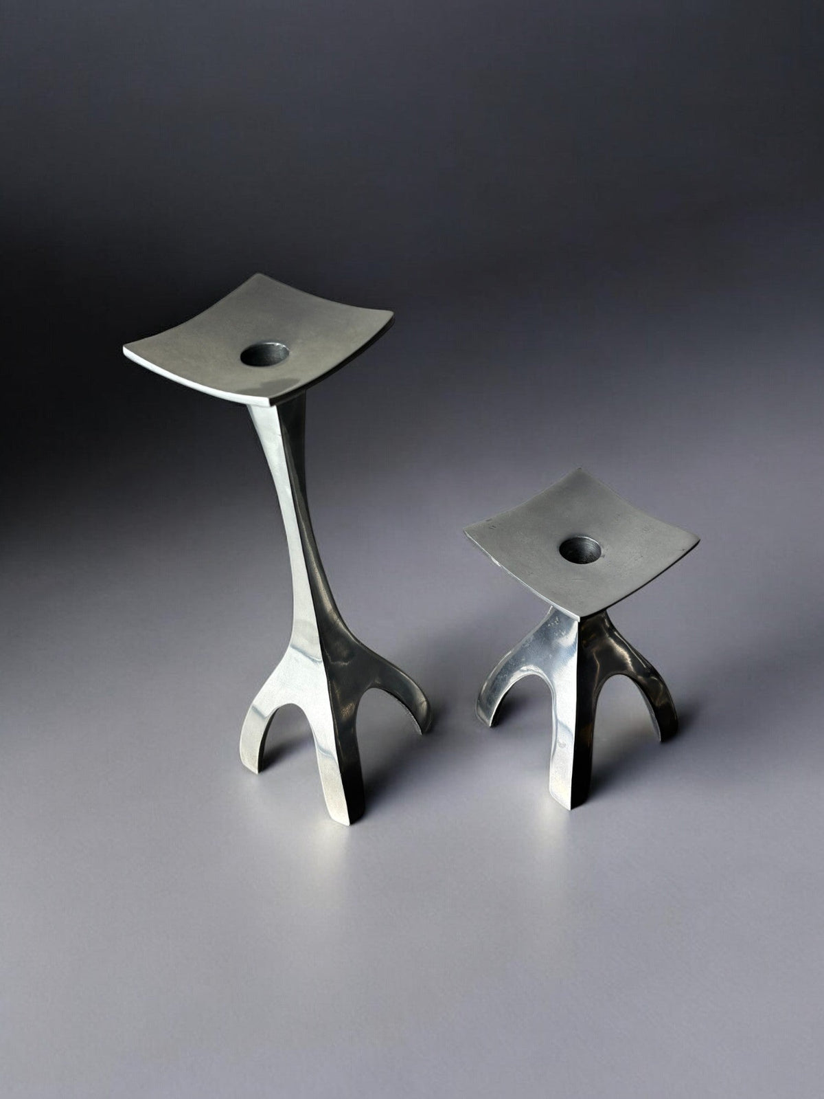Pair of Biomorphic candleholders, solid aluminum, Spain, 1970's — side angle