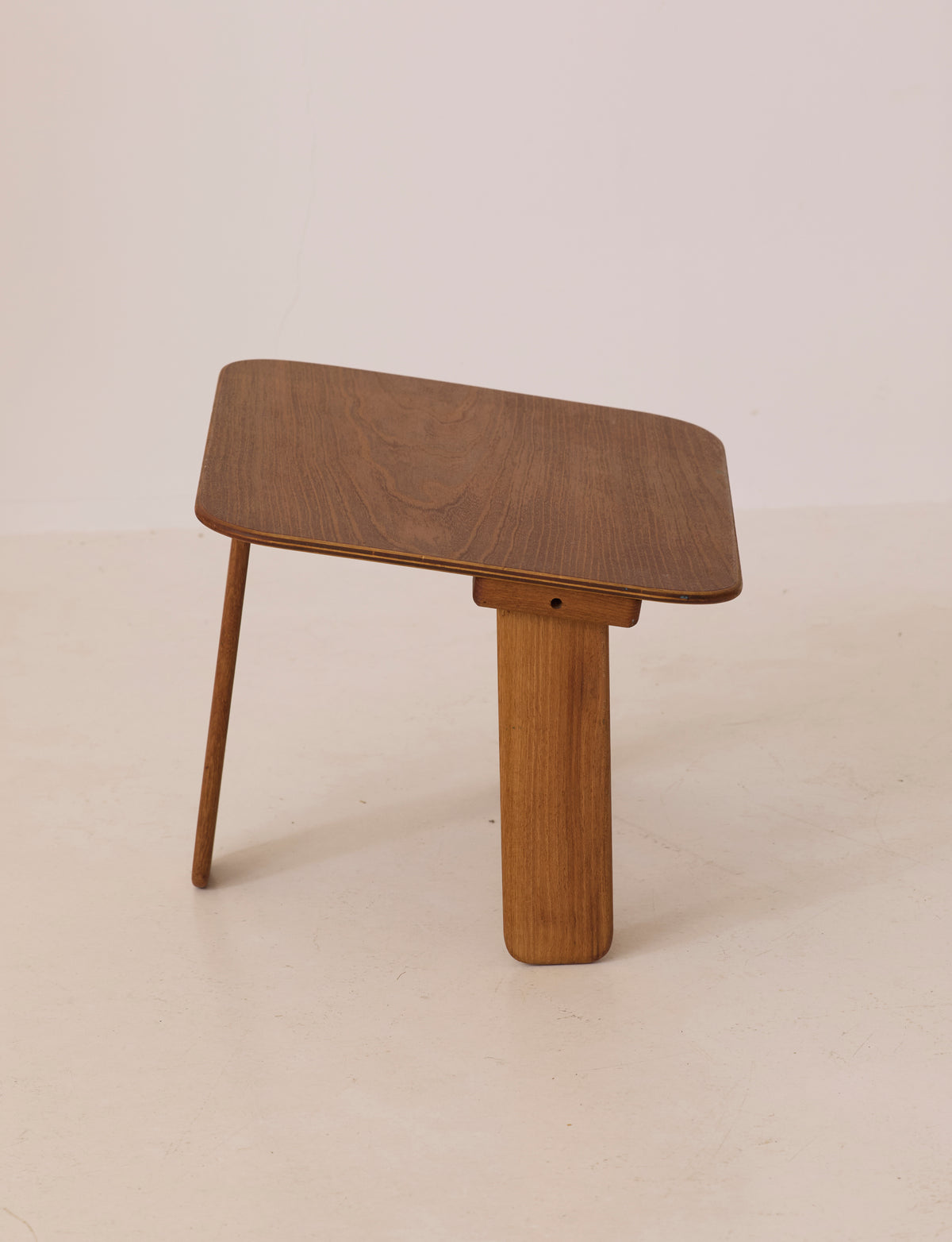 Small dismountable wooden meditation table by Alain Gaubert, France circa 1980 — angled view highlighting rich wood grain tex